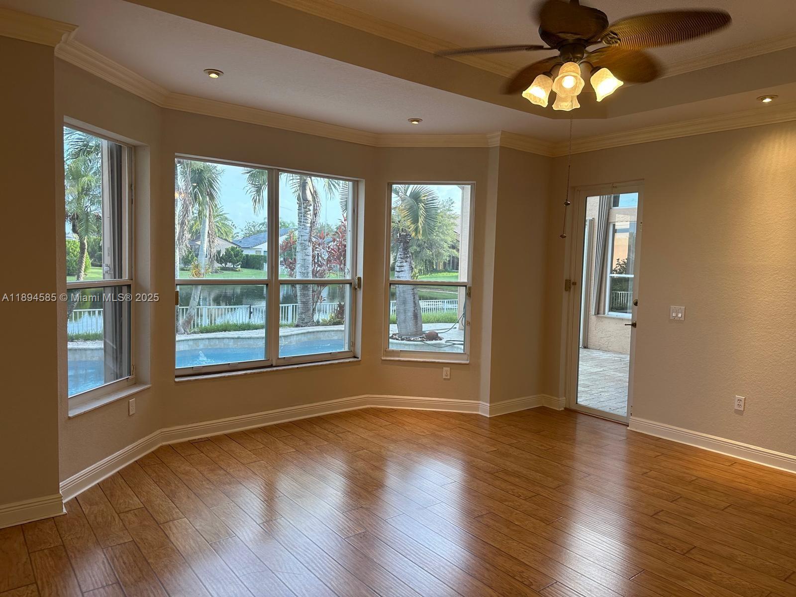 18580 Southwest 44th Street Miramar, FL 33029 - Photo 42 of 71 a view of an empty room with wooden floor and a window