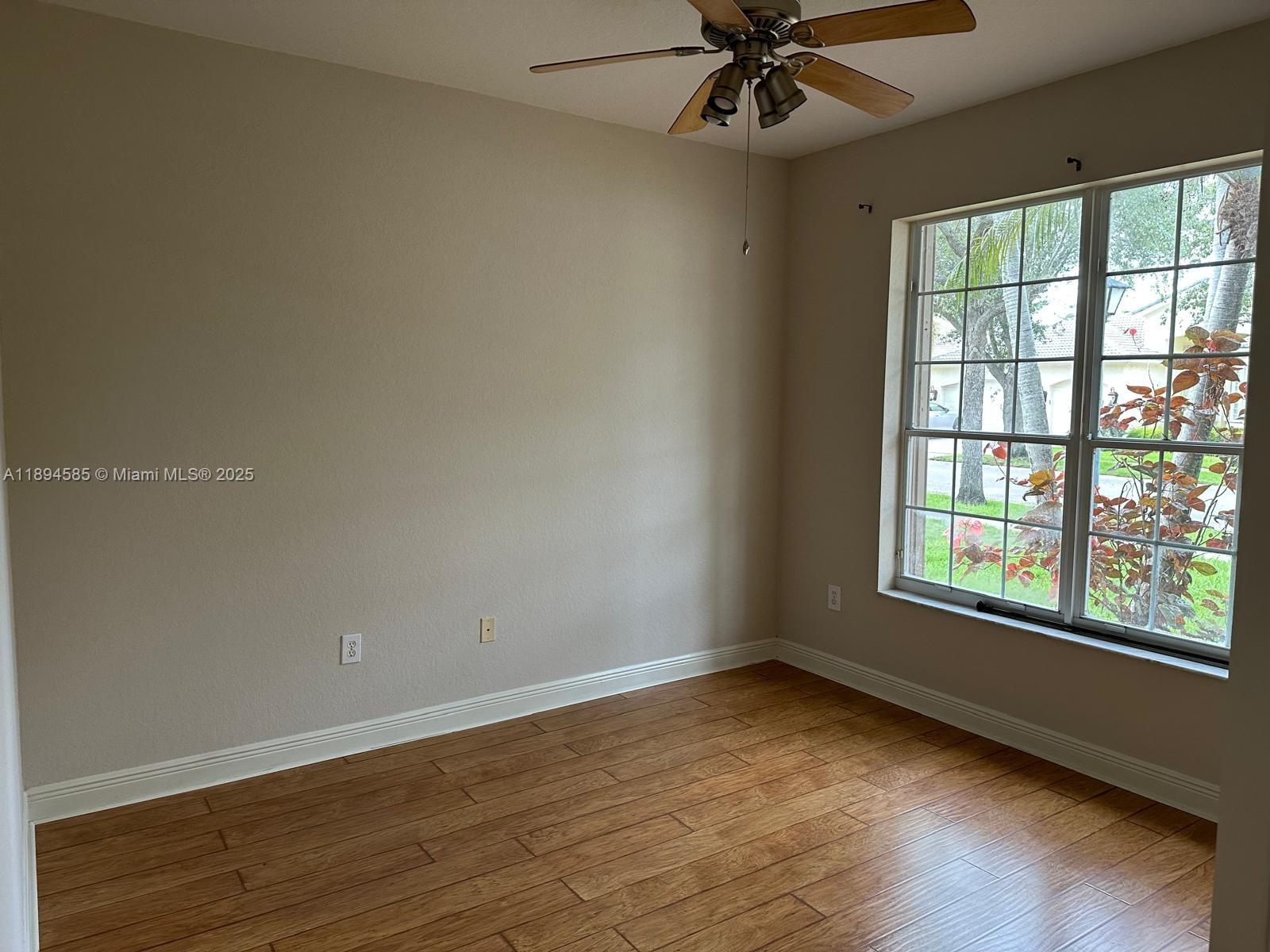 18580 Southwest 44th Street Miramar, FL 33029 - Photo 57 of 71 wooden floor in an empty room with a window