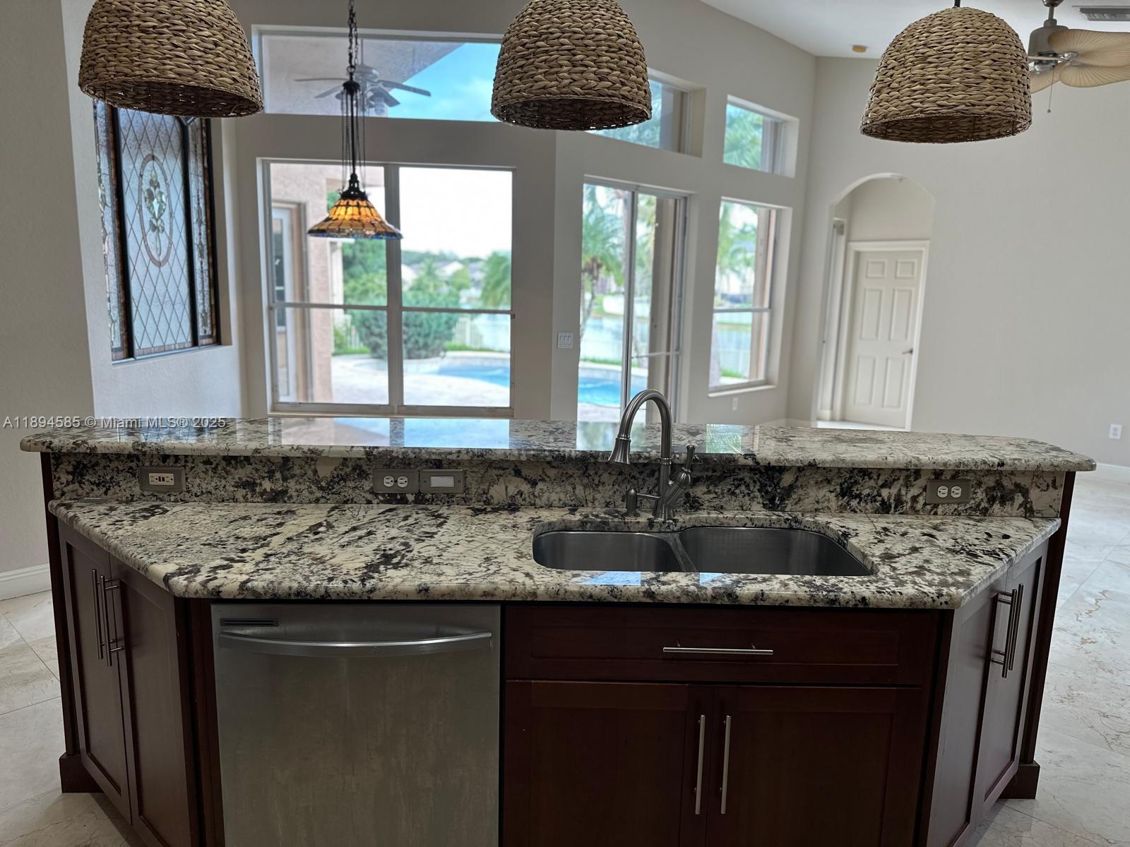 18580 Southwest 44th Street Miramar, FL 33029 - Photo 6 of 71 a kitchen with a sink and a window