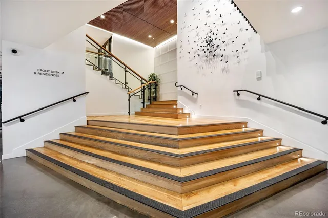 a kitchen with stainless steel appliances a stove a sink and a microwave