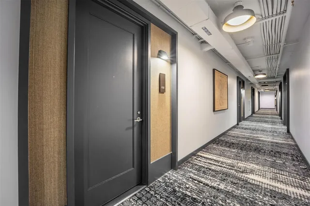 a kitchen with a stove and a wooden floor