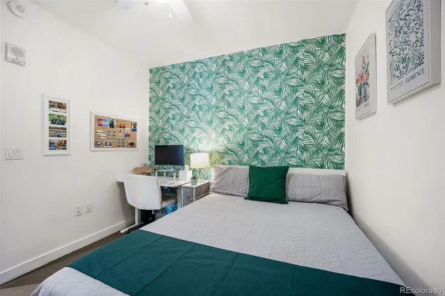 a bedroom with a large bed and a walk in closet