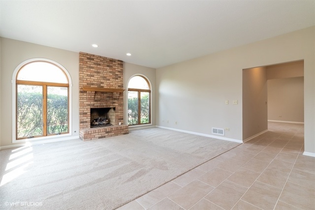154 Bent Tree Lane New Lenox, IL 60451 - Photo 5 of 25 an empty room with furniture and a fireplace