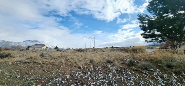 a view of a field of mountains and valleys