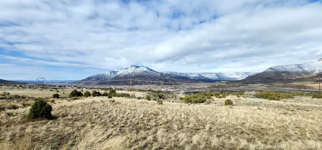 a view of an ocean with a mountain