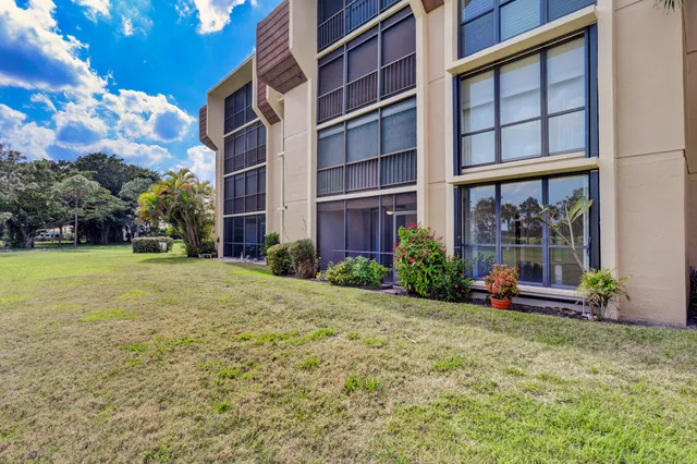 a view of a house with swimming pool having patio