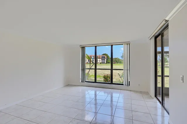 a kitchen with stainless steel appliances granite countertop white cabinets and a sink