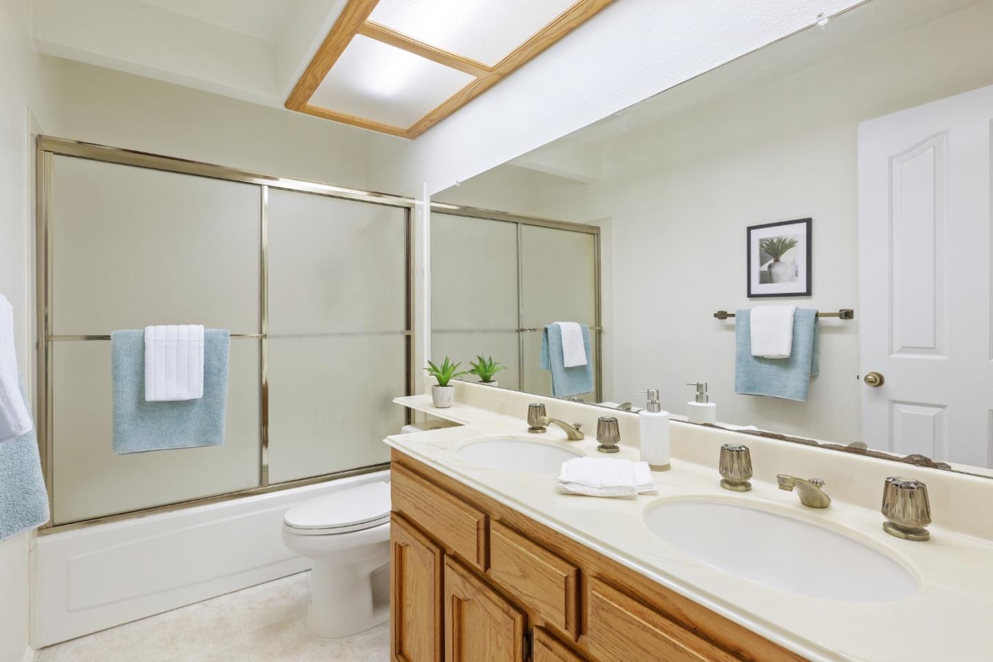 2018 Skyline Drive Milpitas, CA 95035 - Photo 15 of 22 a bathroom with a sink toilet double vanity and shower