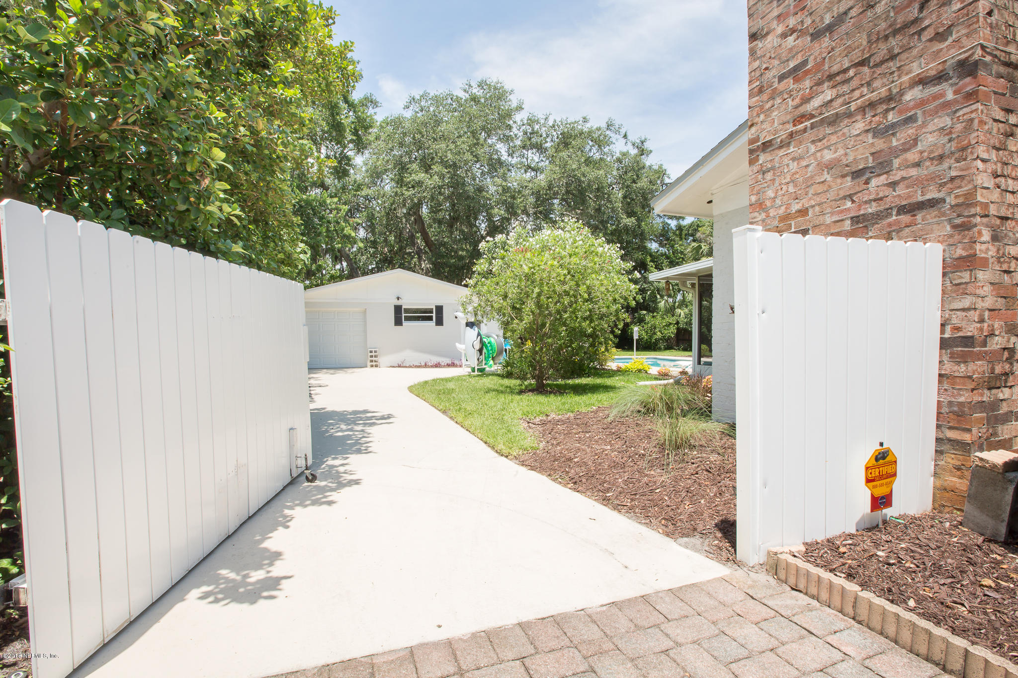 1150 Kings Road Neptune Beach, FL 32266 - Photo 32 of 41 Gate open to Detached Garage