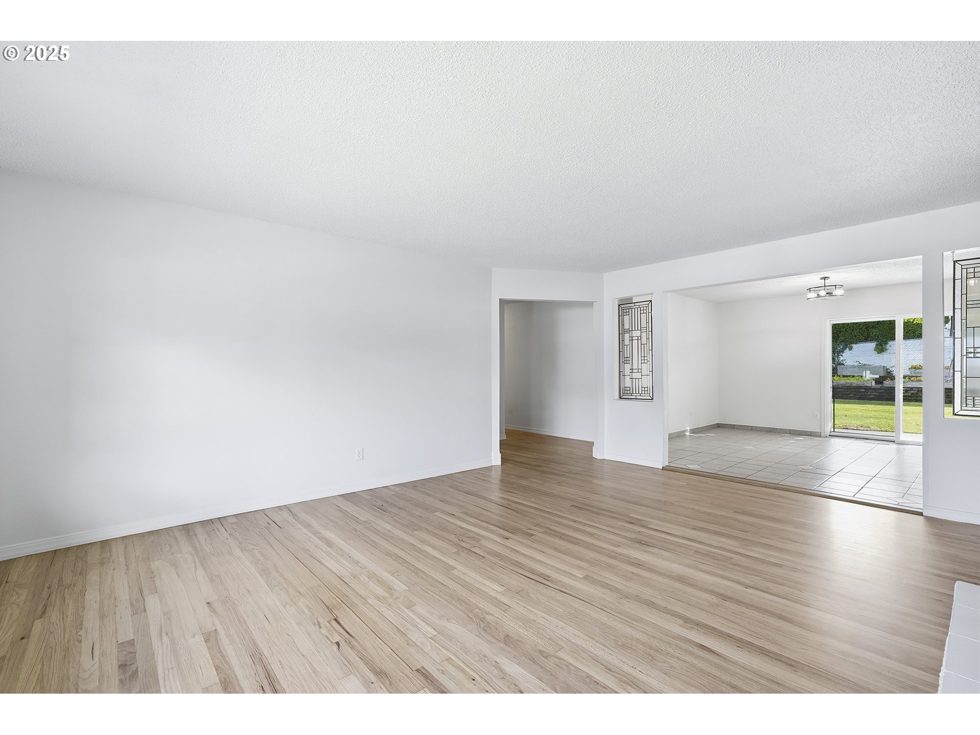 1422 Southeast 209th Avenue Gresham, OR 97030 - Photo 11 of 46 a view of an empty room and wooden floor