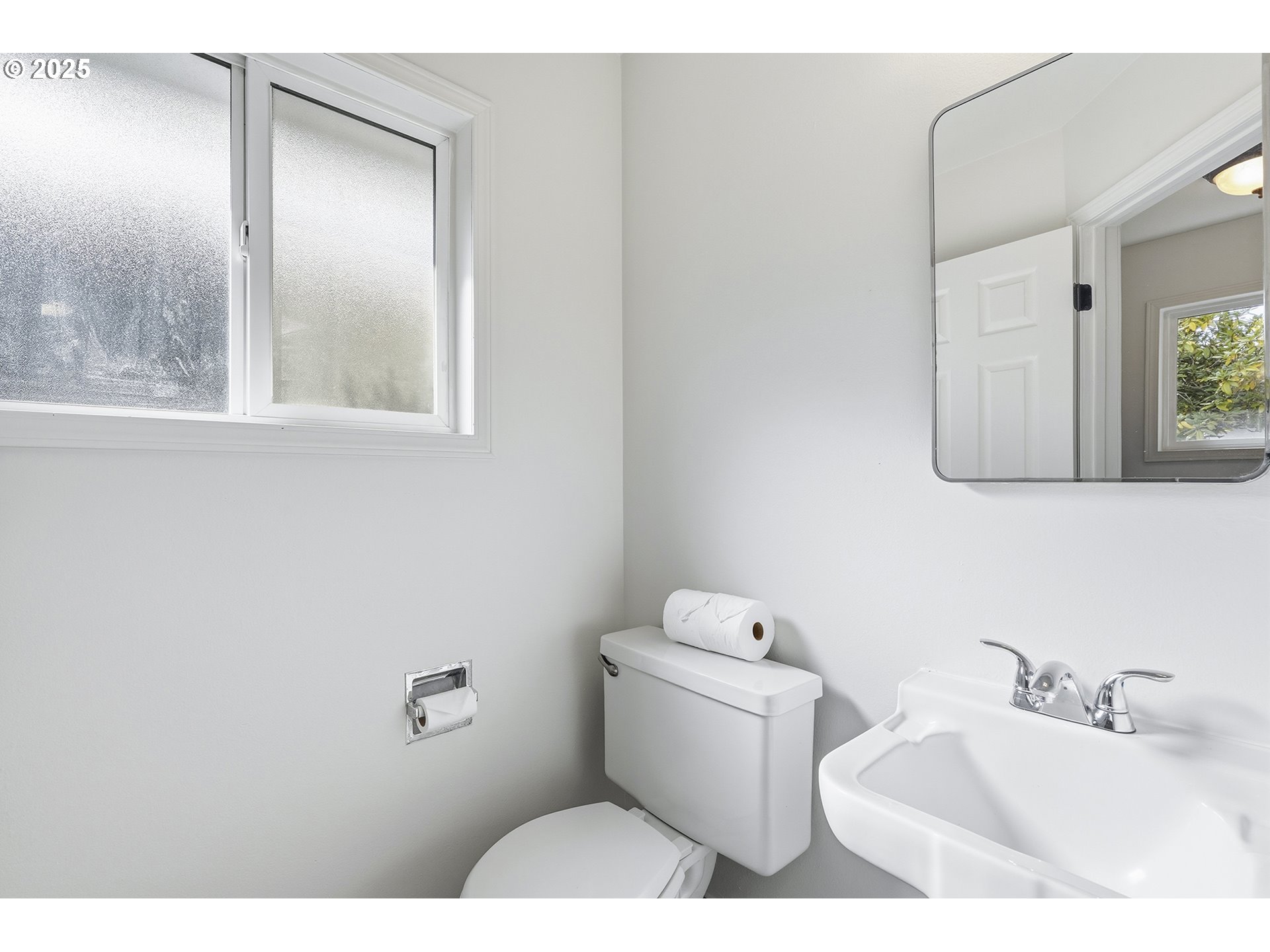 1422 Southeast 209th Avenue Gresham, OR 97030 - Photo 24 of 46 a bathroom with a toilet sink and mirror