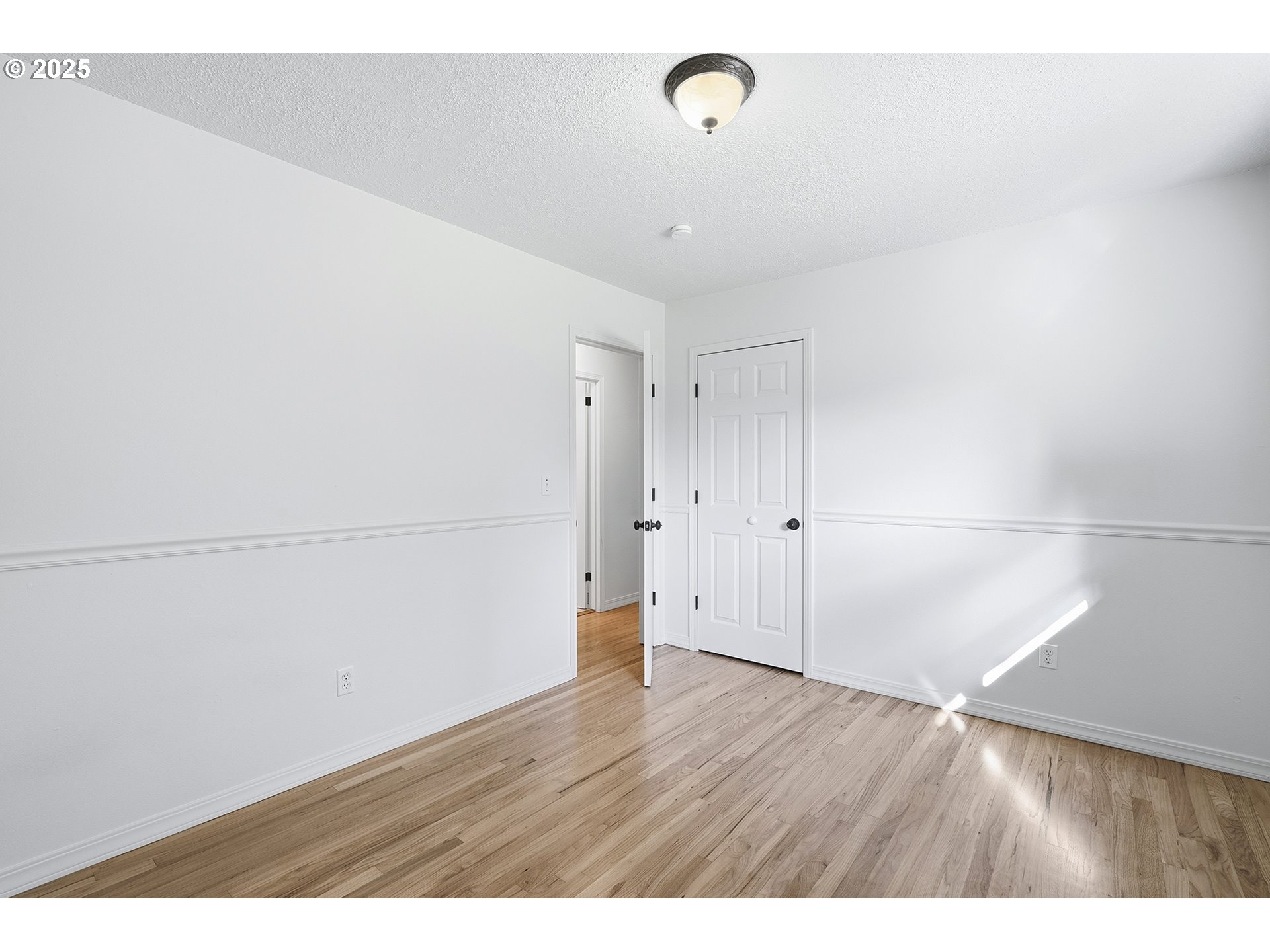 1422 Southeast 209th Avenue Gresham, OR 97030 - Photo 26 of 46 a view of a room with wooden floor