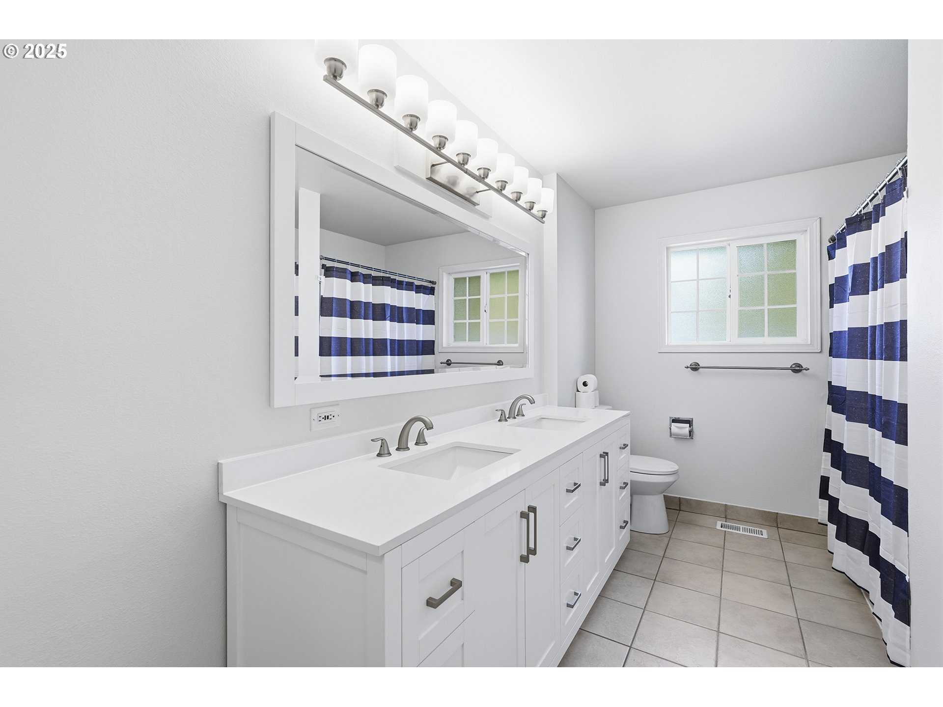 1422 Southeast 209th Avenue Gresham, OR 97030 - Photo 27 of 46 a bathroom with a sink and a mirror