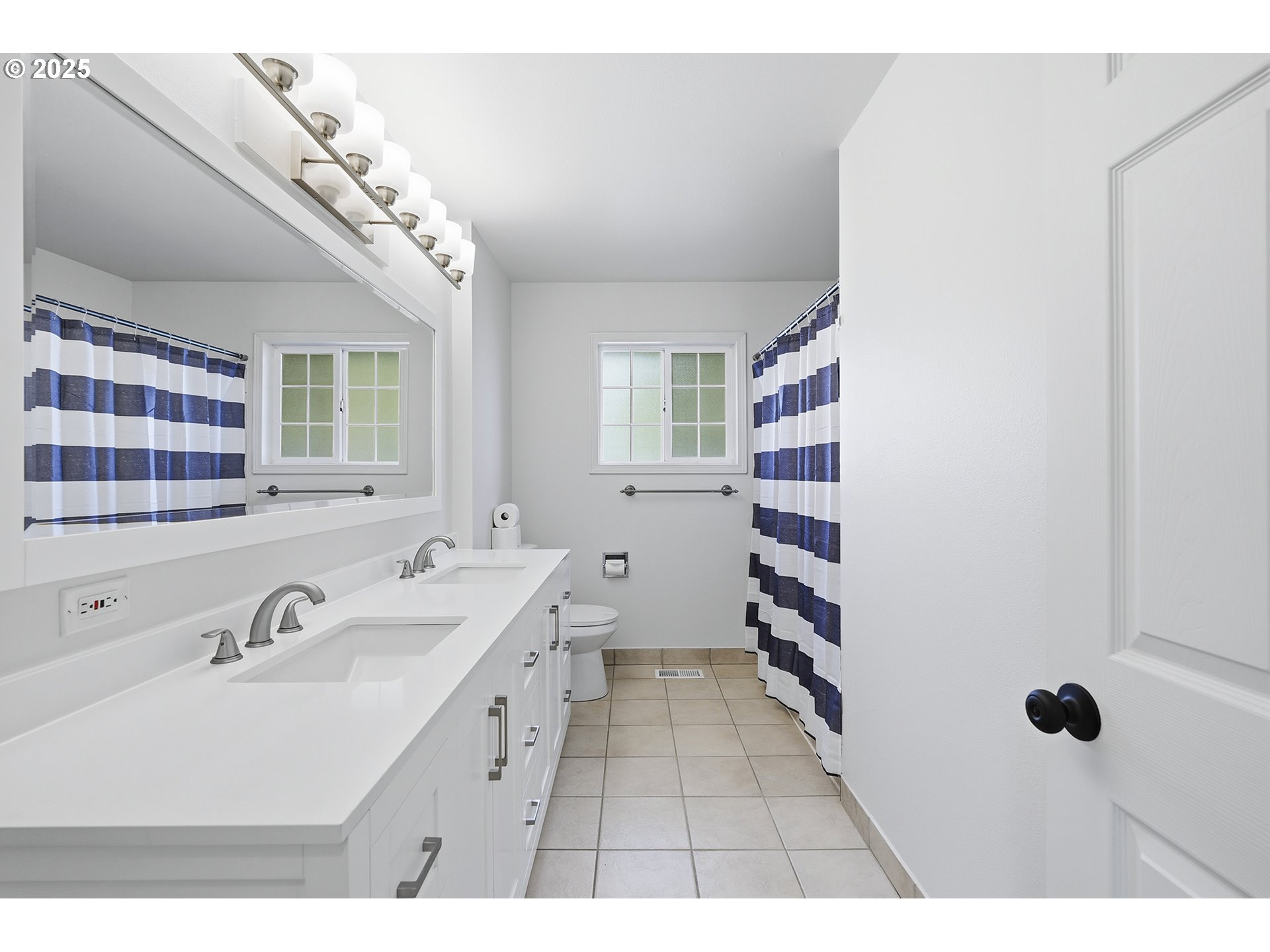 1422 Southeast 209th Avenue Gresham, OR 97030 - Photo 28 of 46 a bathroom with a sink a toilet a shower and a mirror