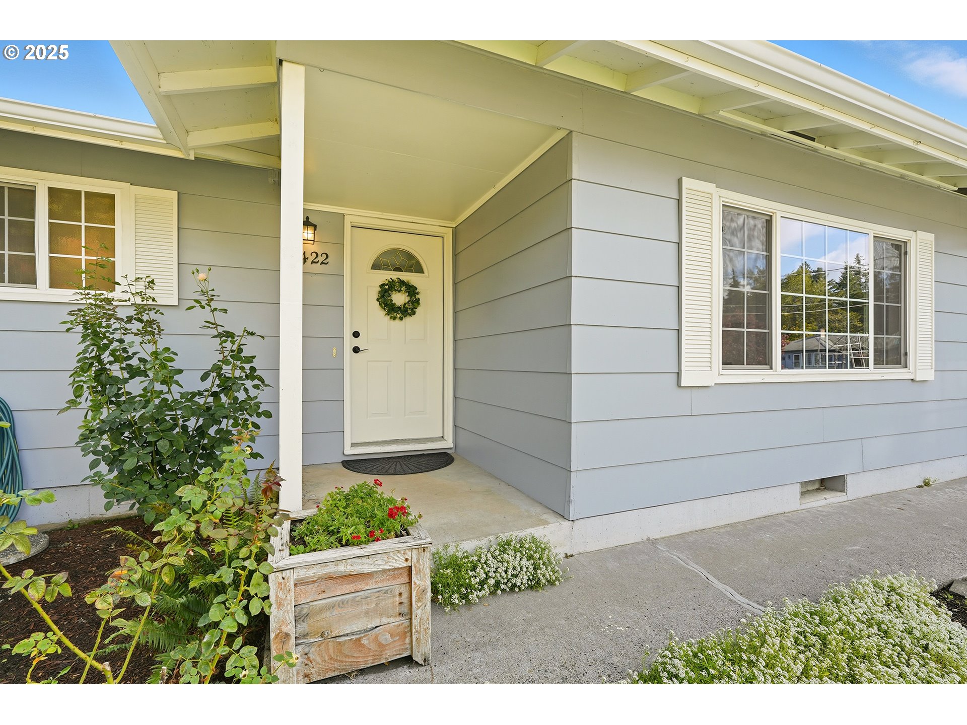 1422 Southeast 209th Avenue Gresham, OR 97030 - Photo 3 of 46 a front view of a house with a yard