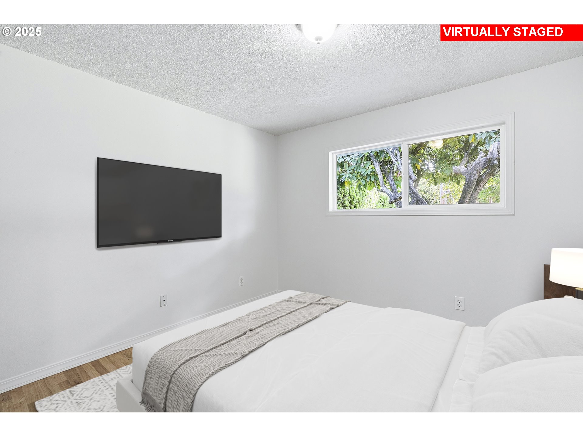 1422 Southeast 209th Avenue Gresham, OR 97030 - Photo 33 of 46 a bedroom with a bed and a flat screen tv