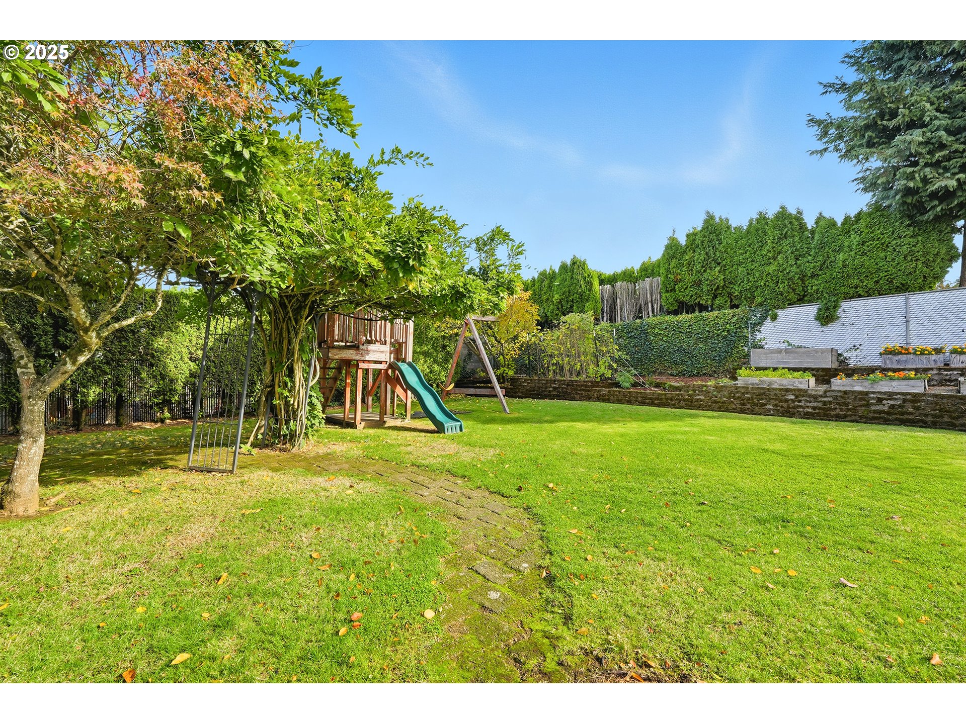 1422 Southeast 209th Avenue Gresham, OR 97030 - Photo 41 of 46 a view of a backyard with a slide