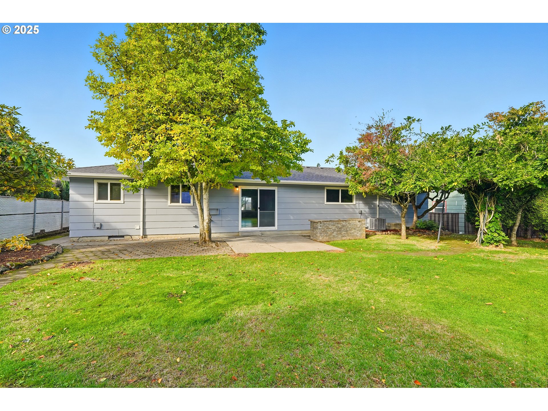1422 Southeast 209th Avenue Gresham, OR 97030 - Photo 45 of 46 a backyard of a house with table and chairs