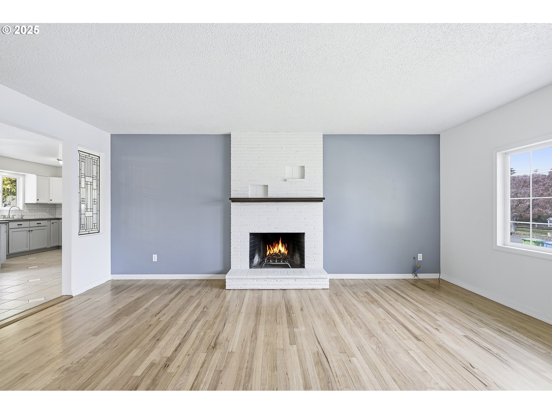 1422 Southeast 209th Avenue Gresham, OR 97030 - Photo 8 of 46 a view of an empty room with window and fire place