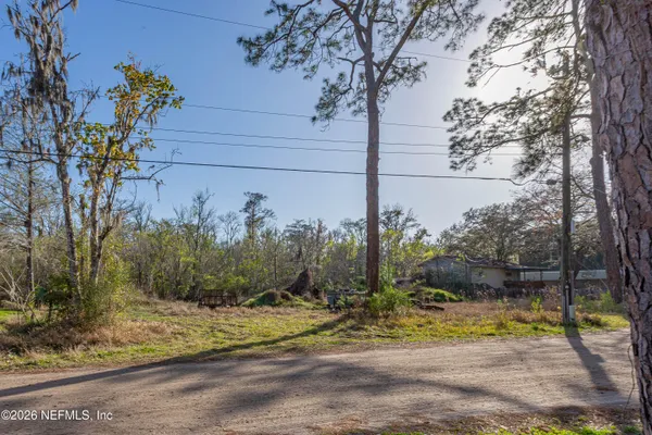 a view of a backyard of the house