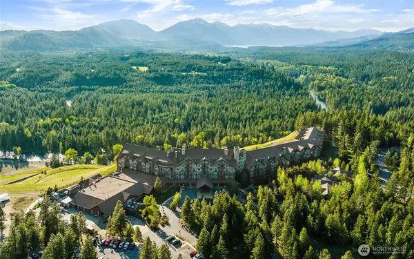 a view of a city with lush green forest