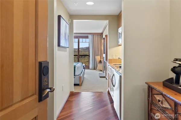 a bathroom with a granite countertop tub sink shower and mirror