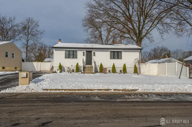 a view of house with a yard