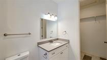 1709 Sycamore Street, Unit 2 Commerce, TX 75428 - Photo 11 of 11 a bathroom with a sink vanity and a mirror