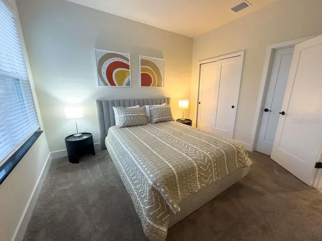 a bathroom with a sink a toilet a shower and a mirror