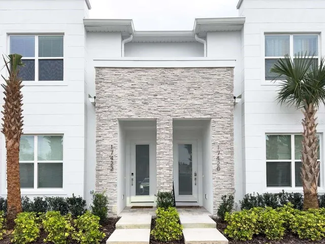 front view of a house with a garden