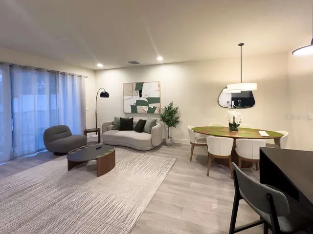 a living room with furniture and a table