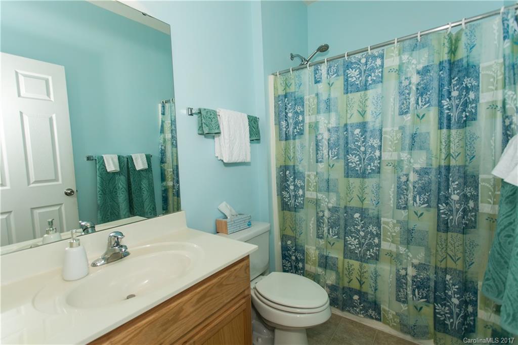 7123 Meyer Road, Unit 263 Fort Mill, SC 29715 - Photo 14 of 24 a bathroom with a sink a toilet and shower