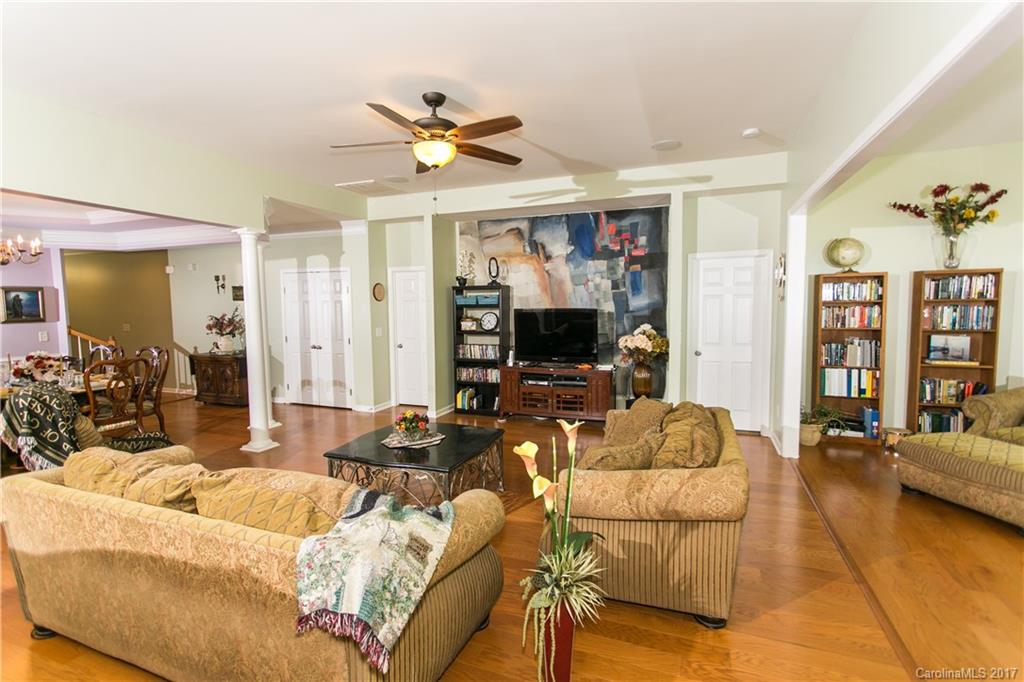 7123 Meyer Road, Unit 263 Fort Mill, SC 29715 - Photo 3 of 24 a living room with furniture a flat screen tv and a large window