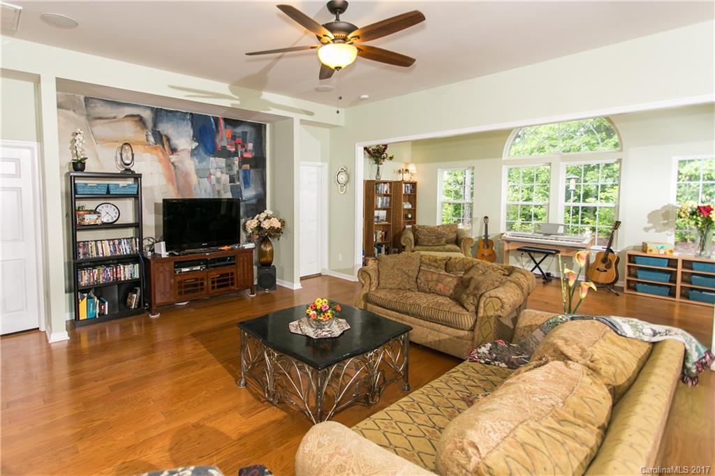7123 Meyer Road, Unit 263 Fort Mill, SC 29715 - Photo 4 of 24 a living room with furniture and a flat screen tv