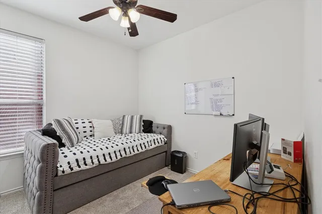 a bedroom with furniture and a window