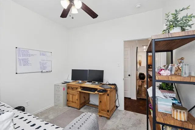 a kitchen with granite countertop a refrigerator stove microwave and sink