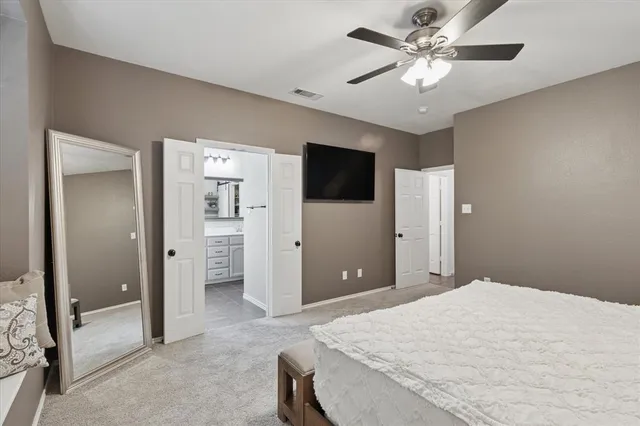 a bathroom with a tub a sink and a large mirror