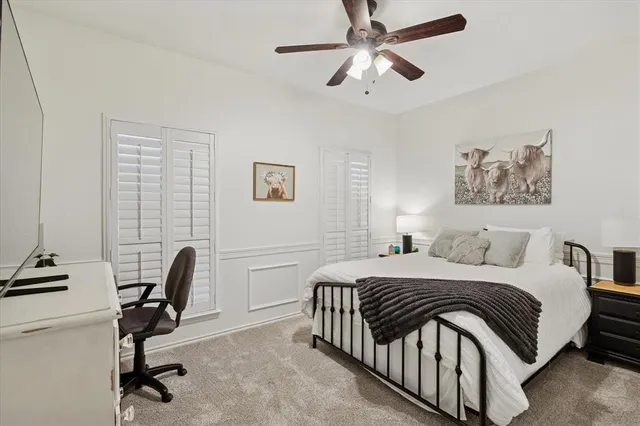 a bedroom with a bed and a lamp