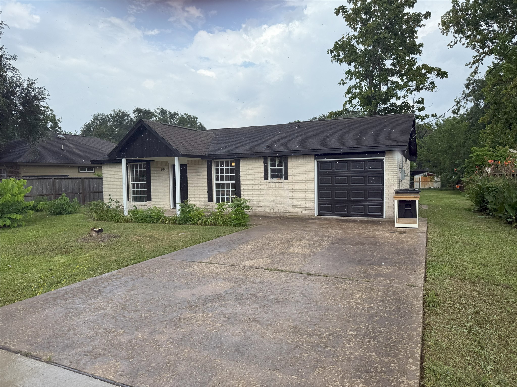12727 Zavalla Street Houston, TX 77085 - Photo 2 of 8 front view of a house with a yard
