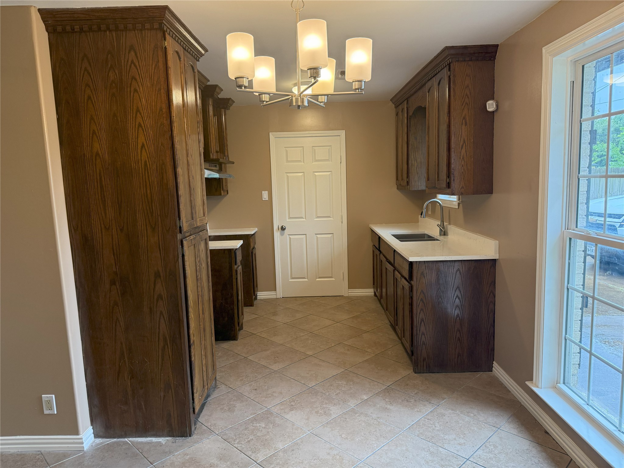12727 Zavalla Street Houston, TX 77085 - Photo 4 of 8 a spacious bathroom with a mirror a sink and shower