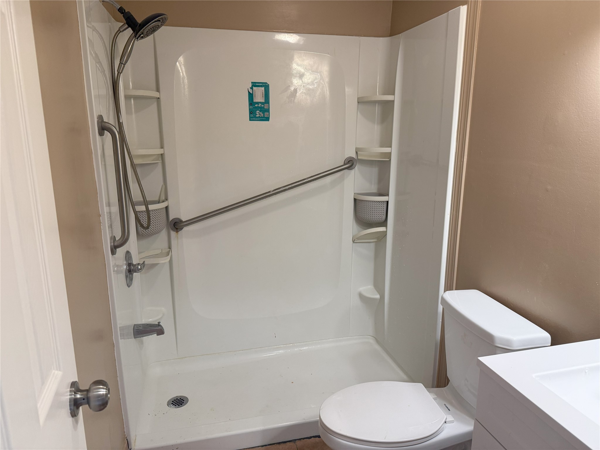 12727 Zavalla Street Houston, TX 77085 - Photo 5 of 8 a white toilet sitting next to a bath tub