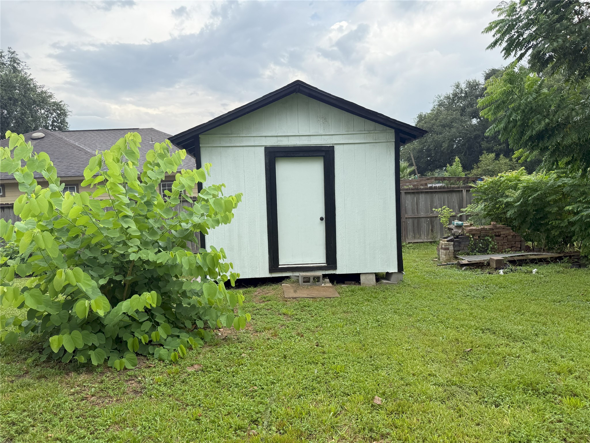 12727 Zavalla Street Houston, TX 77085 - Photo 7 of 8 a view of a house with a garden