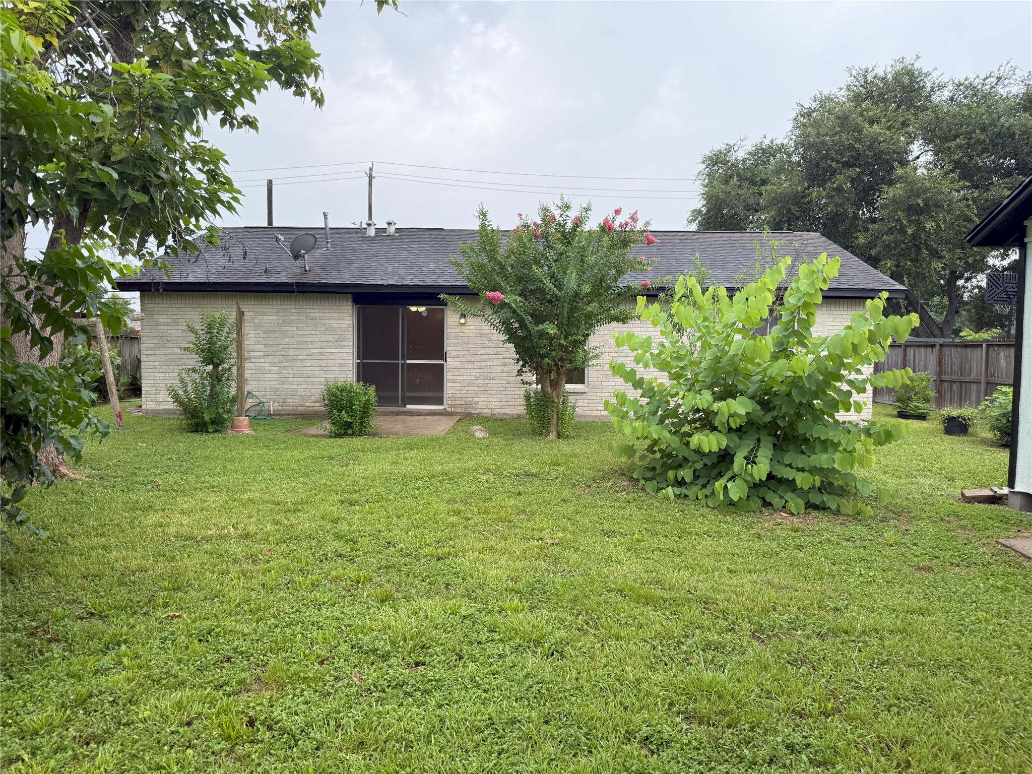 12727 Zavalla Street Houston, TX 77085 - Photo 8 of 8 a front view of a house with garden