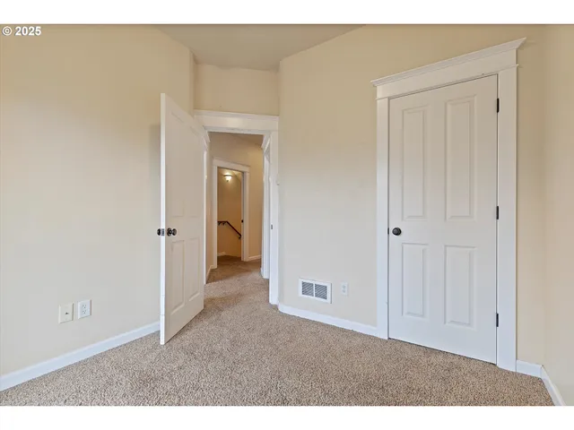 an empty room with sliding glass door