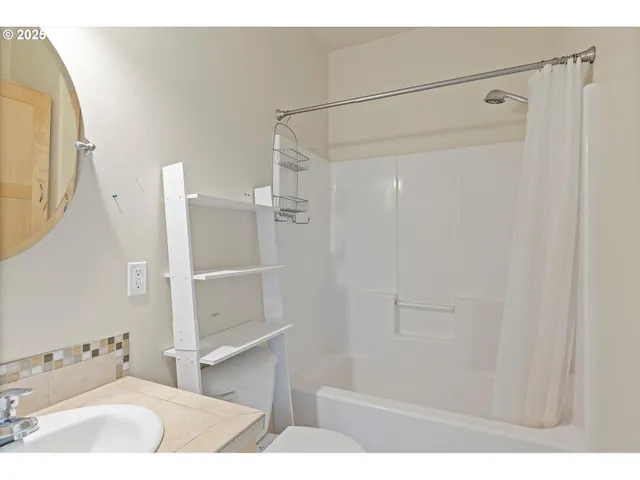 a bathroom with a sink vanity and a mirror