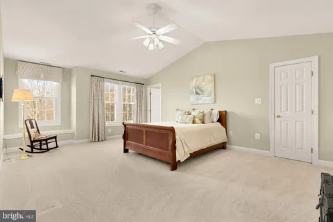 a bed room with a bed and a window