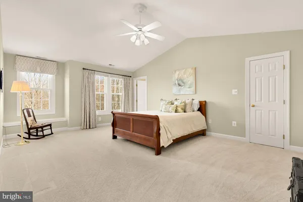 a bed room with a bed and a window