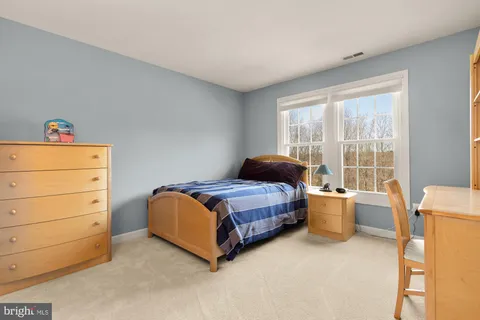 a room with a bed and a window