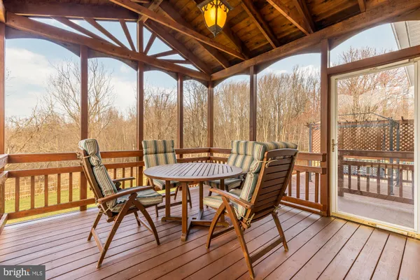 a view of a chairs on wooden deck