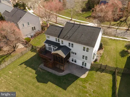 an aerial view of a yard with table and chairs